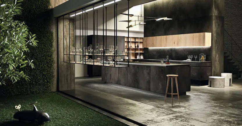 Cuisine ouverte sur salon avec de nombreux éléments de rangements notamment des meubles hauts